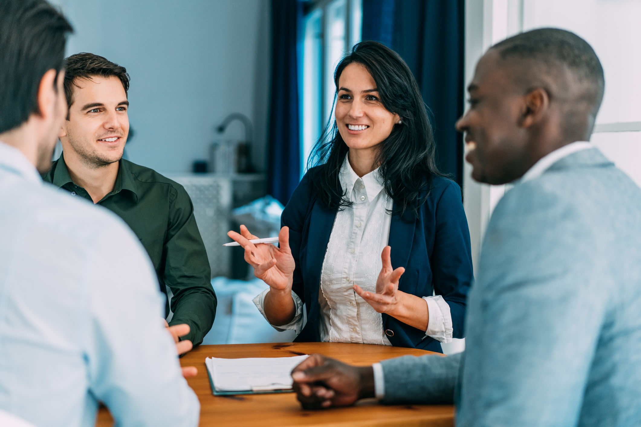 ALCS Business talking in group at office table