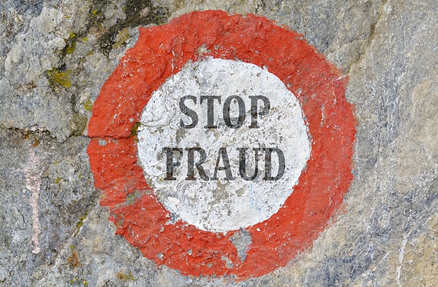 sign reading stop fraud