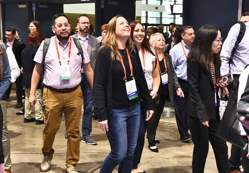Payments attendee walk into hall