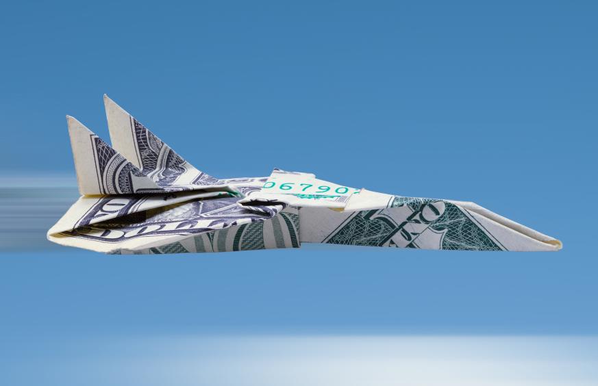 image of dollar bill folded into shape of a plane 
