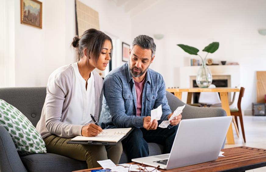 ACH Paying bills online two people on couch