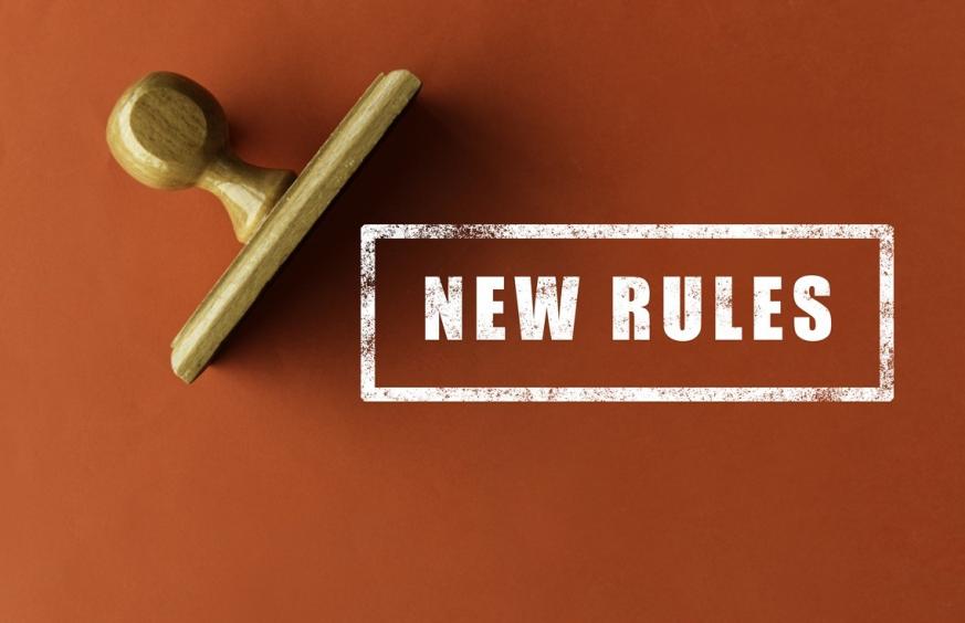 Image of stamp that reads New Rules