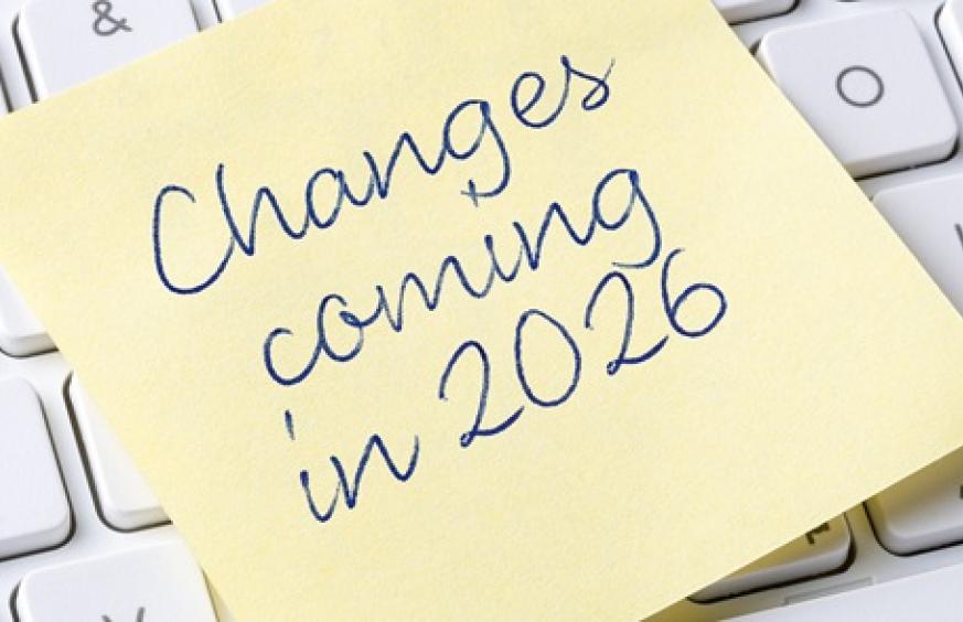 post it note on keyboard reading changes coming in 2026