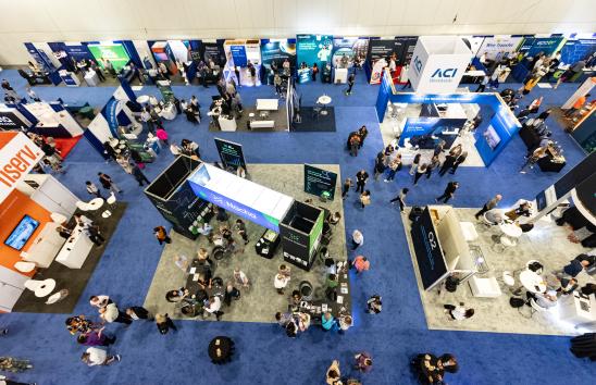 exhibitor floor with nacha's booth at the center
