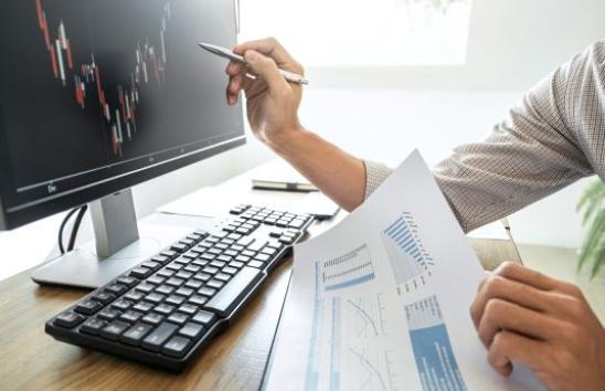 image of hand pointing to computer monitor