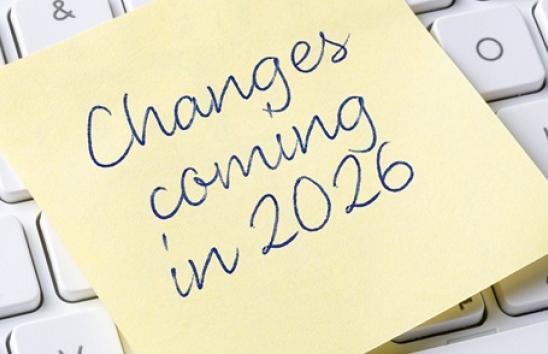 post it note on keyboard reading changes coming in 2026