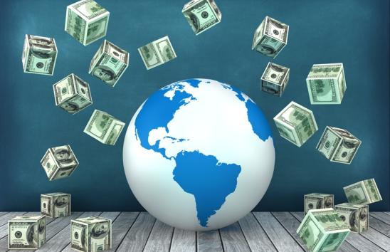 a globe surrounded by blocks made of u.s. dollars