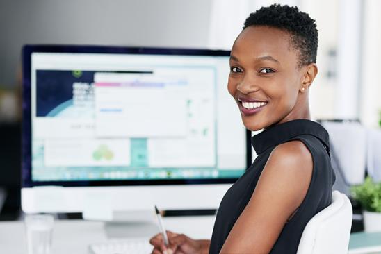 Female smiling at computer