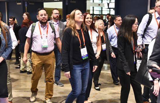 Payments attendee walk into hall